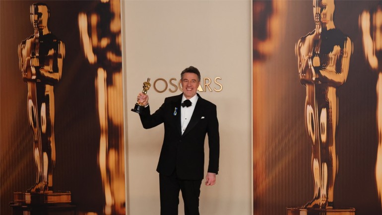 Screenwriter Peter Straughan receives an Oscar® in the Writing (Adapted Screenplay) category