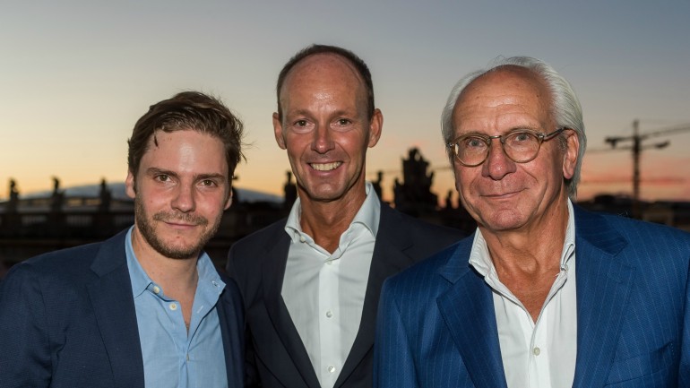 Thomas Rabe and Wolf Bauer with actor Daniel Brühl