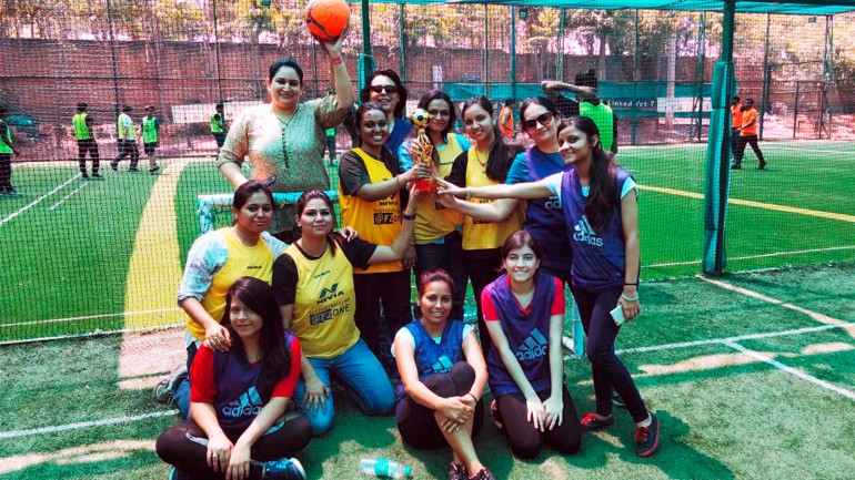 The employees of DK India won the women’s football tournament.